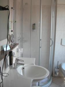 Koupelna v ubytování Apart Hotel Norden