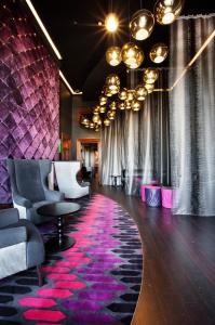 a lobby with a pink and purple carpet at Treasury Brisbane in Brisbane