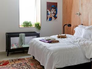 Postel nebo postele na pokoji v ubytování Q-Factory Hotel