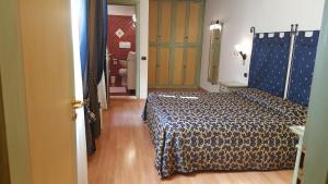 a hotel room with a bed and a bathroom at Residence La Repubblica in Florence