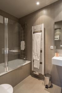 Koupelna v ubytování Four Stars Aparthotel