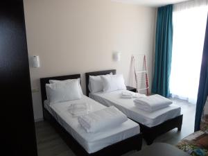Postel nebo postele na pokoji v ubytování Apartments in Casa del Sol + 22 fotografií