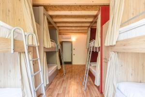 a room with a bunch of bunk beds at Hostel Antique in Pula