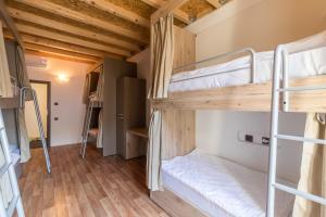 a room with a bunch of bunk beds at Hostel Antique in Pula