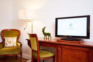 TV a/nebo společenská místnost v ubytování Hotel Prinzregent München Messe