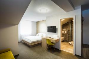 Postel nebo postele na pokoji v ubytování Hotel Rokiten