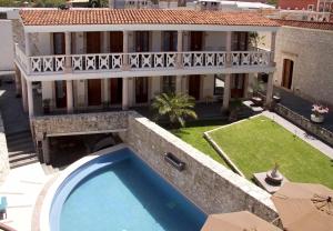 an aerial view of a house with a swimming pool at Casa Mateo Hotel Boutique in Bernal