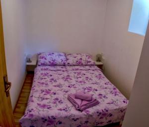 Postel nebo postele na pokoji v ubytování Apartments & Room Toni