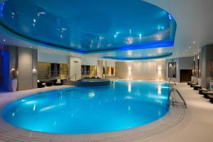 a large blue swimming pool in a hotel room at The Gleneagles Hotel in Auchterarder