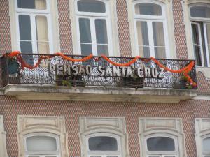 a banner on a balcony of a building at Pensão Santa Cruz in Coimbra