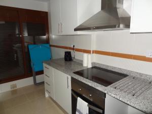 A kitchen or kitchenette at Apartament Lazurowy