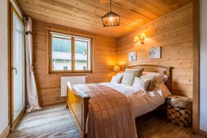 Postel nebo postele na pokoji v ubytování Appartement Midi Romand proche Morzine