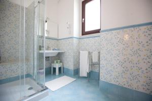 a bathroom with a shower and a sink at Italiana Resort Maniace in Siracusa +47 photos