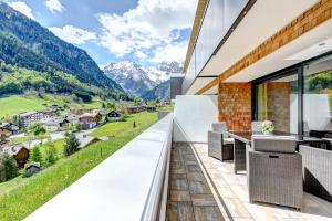 a balcony with a view of mountains at Bergzauber Appartements in Brand