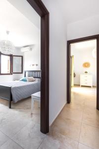 A bed or beds in a room at Wormwood - Morfi Village