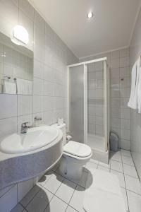 a bathroom with a toilet and a sink and a shower at Hotel Senad od Bosne in Prokosovići