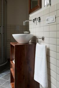 a bathroom with a white sink and a towel at Assaporarte in Florence