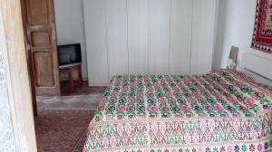 Een bed of bedden in een kamer bij L'albero di Giuggiole