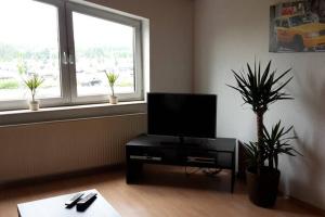 Ruang duduk di TLA Apartment with Garden