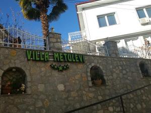a building with a sign that reads vlez melez at Villa Metulevi in Ohrid