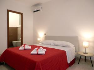 Postel nebo postele na pokoji v ubytování Corsaro B&B