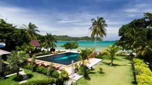 an aerial view of a resort with a swimming pool and the ocean at Starlight Resort Koh Phangan in Thong Nai Pan Yai