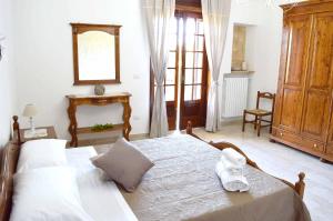 Postel nebo postele na pokoji v ubytování B&B Profumo di Alloro
