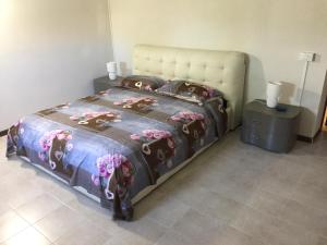 En eller flere senge i et værelse på Casa Vacanza Caronia
