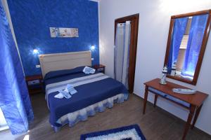 Postel nebo postele na pokoji v ubytování B&B Empedocle