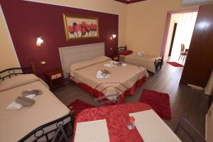 Postel nebo postele na pokoji v ubytování B&B Empedocle