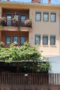 an apartment building with flowers on the balconies at Joleski Accommodation in Ohrid