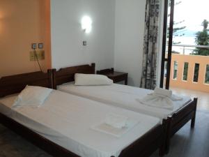 Ένα ή περισσότερα κρεβάτια σε δωμάτιο στο Thodorou Villa  +17 φωτογραφίες