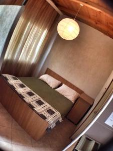 a small room with a bunk bed in a house at Apartments President in Star Dojran