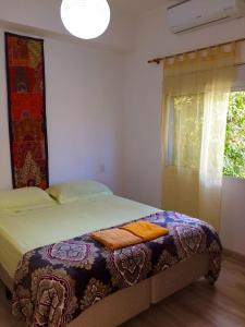 Cama ou camas em um quarto em Zen Hotel Brasil