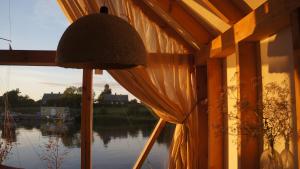 a room with a window with a view of the water at Peldmaja in Pāvilosta +6 photos