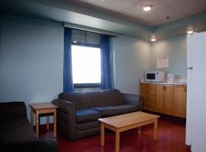 a living room with a couch and a table at Mount Saint Vincent University in Halifax