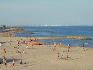 a group of people on a beach near the water at Villa Cemaste in Montpellier