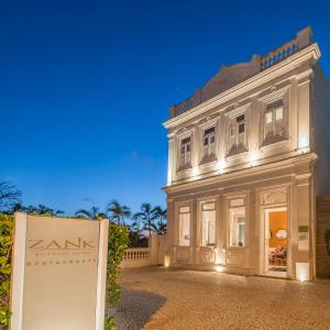 a large building with a clock on the front of it at Zank by Toque Hotel in Salvador