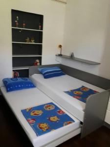 two twin beds in a small room at Apartment Hela in Zadar