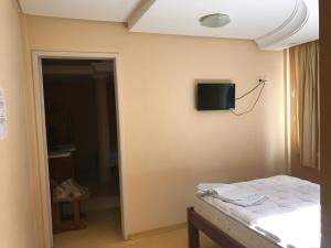 Ένα ή περισσότερα κρεβάτια σε δωμάτιο στο Hotel Texacao do Cavera
