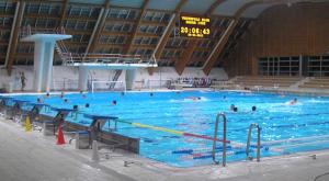 a large swimming pool with many people in it at Apartment Hela in Zadar