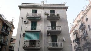 a tall building with balconies on the side of it at A casa di Alice in Rome