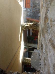 an alley with stairs leading up to a building at Casa Vacanze Storica in Seborga