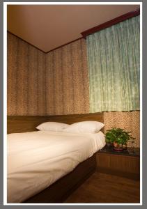Postel nebo postele na pokoji v ubytování Hotel Lee-Chan