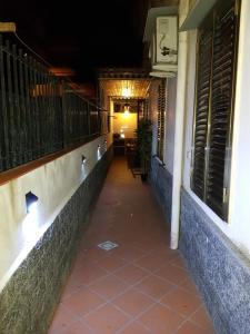 an empty hallway of a building at night at Holiday house Chiara in Giardini Naxos