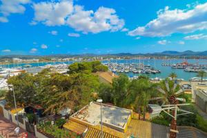 a view of a harbor with boats in the water at Es Mitjorn in San Antonio