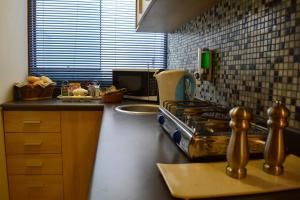 Cucina o angolo cottura di Kangaroo Wasi Airport Bed & Breakfast