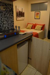 Cucina o angolo cottura di Kangaroo Wasi Airport Bed & Breakfast