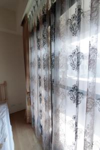 Postel nebo postele na pokoji v ubytování Jin Du Yi Yuan B & B