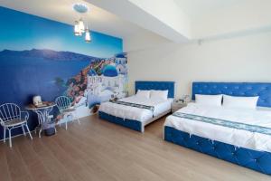 Postel nebo postele na pokoji v ubytování Jin Du Yi Yuan B & B